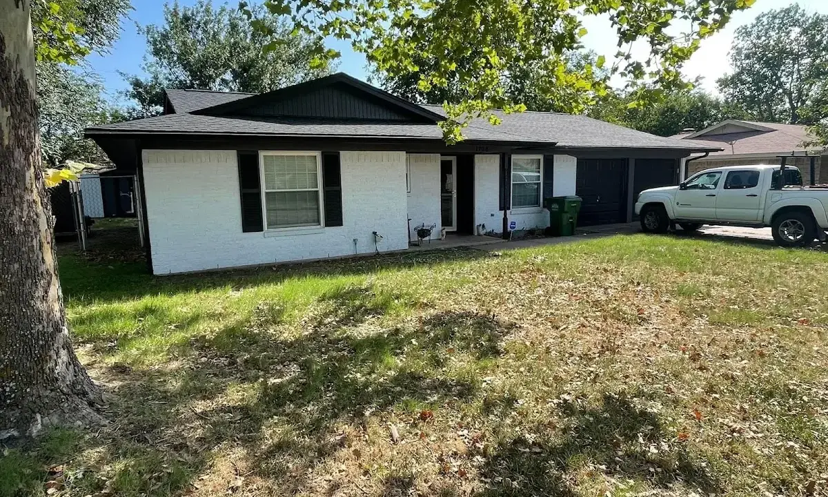 Professional roofing crew working on a residential roof in Elburn